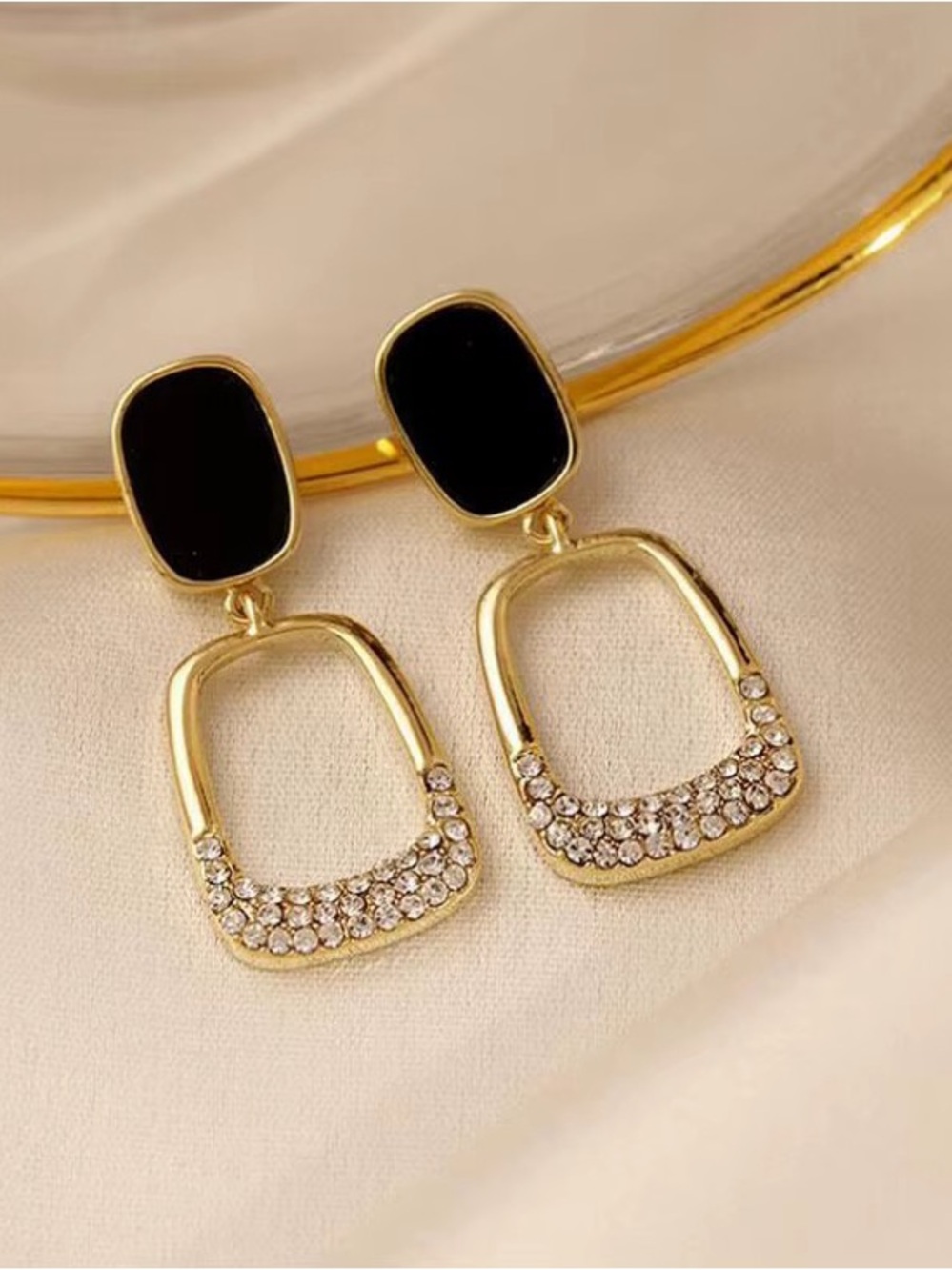Elegant Gold Drop Earrings with Black Enamel and Crystal Accent